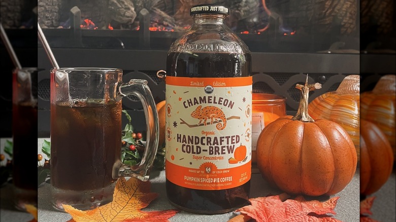 A bottle and glass of Chameleon Handcrafted Cold Brew Pumpkin Spiced Pie Coffee