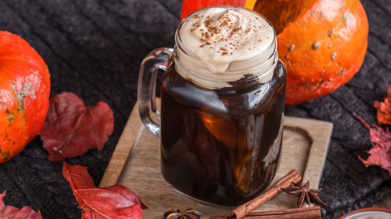 Pumpkin spice cold brew in a glass mug