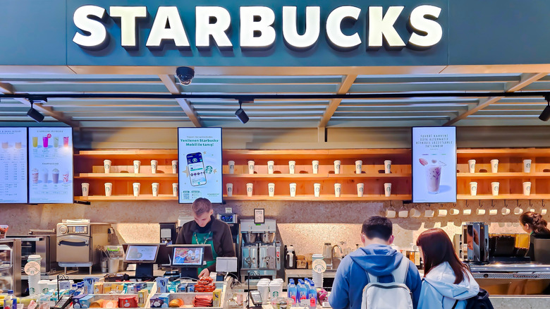 A starbucks location with customers