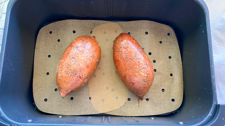 Sweet potatoes in air fryer basket