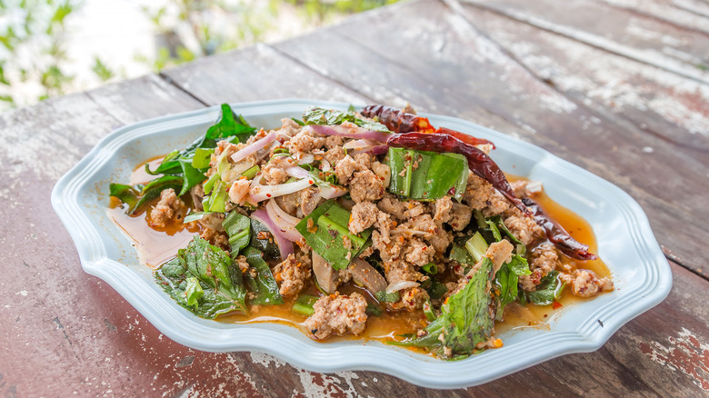 Thai chicken larb on a wooden table