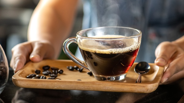 cup of hot coffee on tray