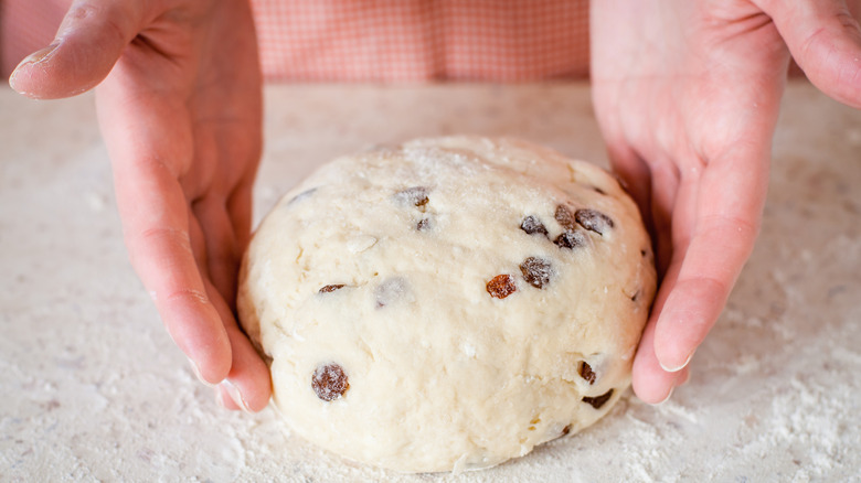 Kneading bagel dough with raisins