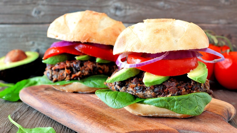 black bean burgers with avocado onions and tomatoes