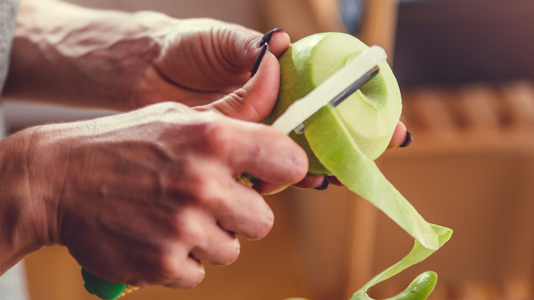 peeling a Granny Smith apple