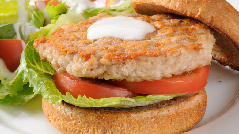 Chicken burger with lettuce and tomato 