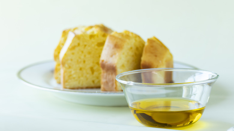 bowl of olive oil and slices of cake