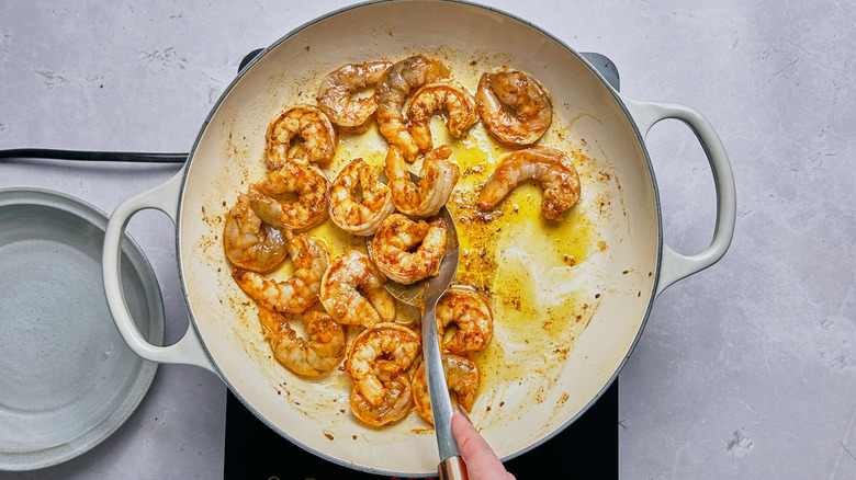 Shrimp cooking in pan