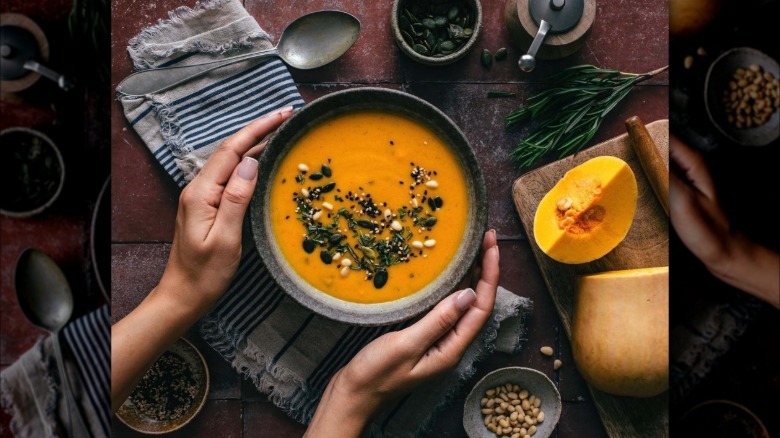 Butternut squash soup with herbs and seeds