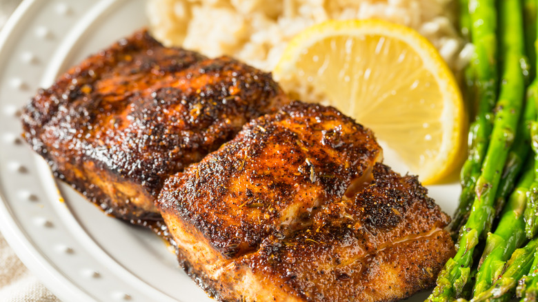 Blackened fish with rice and asparagus