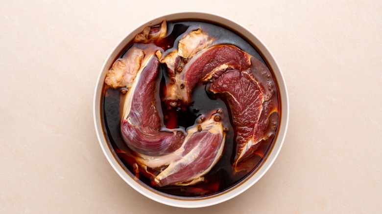 meat marinating in bowl