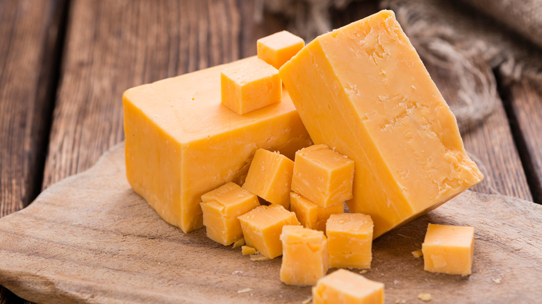 cubed block of cheddar cheese