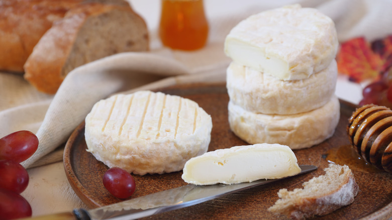 goat cheese wheels on platter