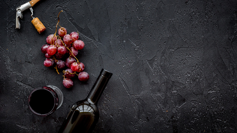 Wine bottle with grapes and cork