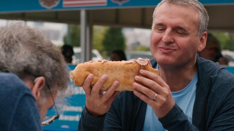 Phil Rosenthal looking at food