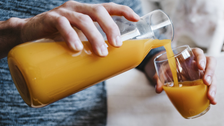 Pouring juice into glass