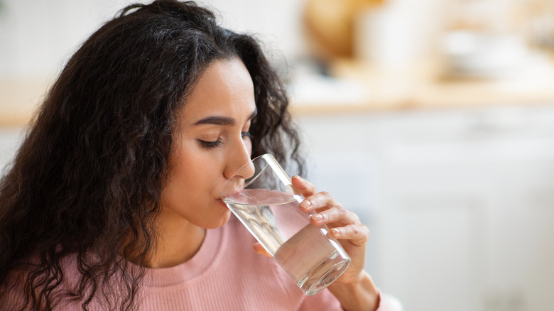 woman drinking glass of water