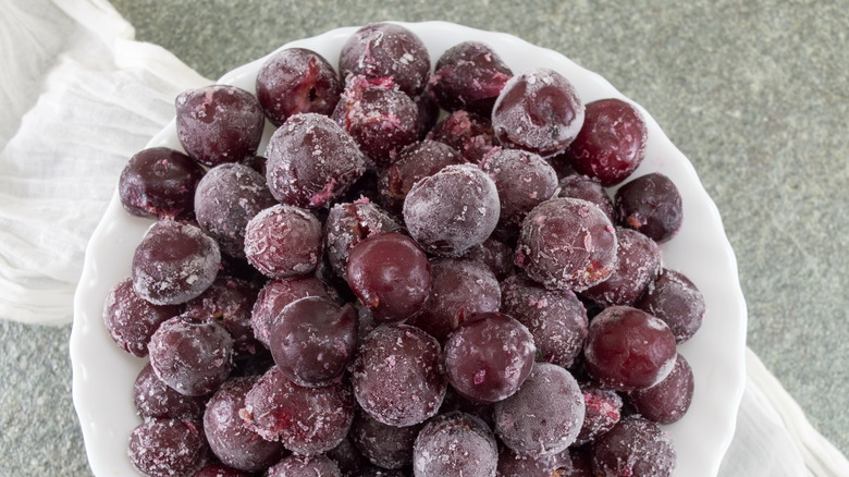 Frozen grapes in white bowl