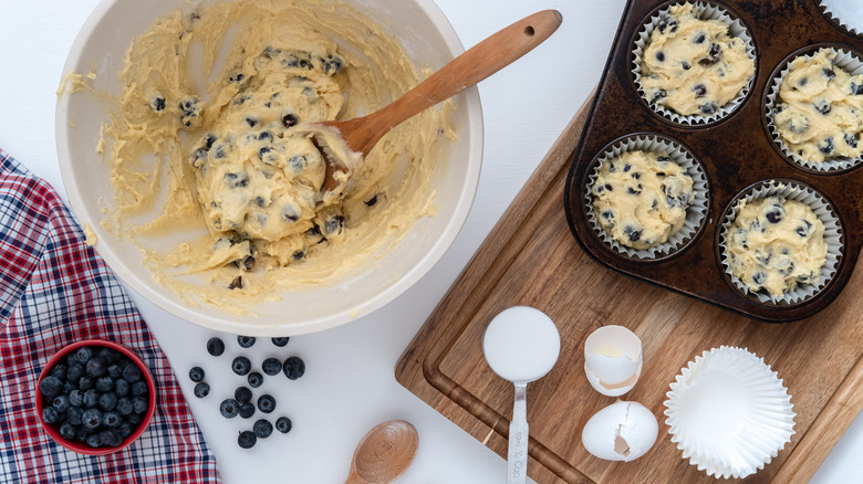 Preparing blueberry muffin batter