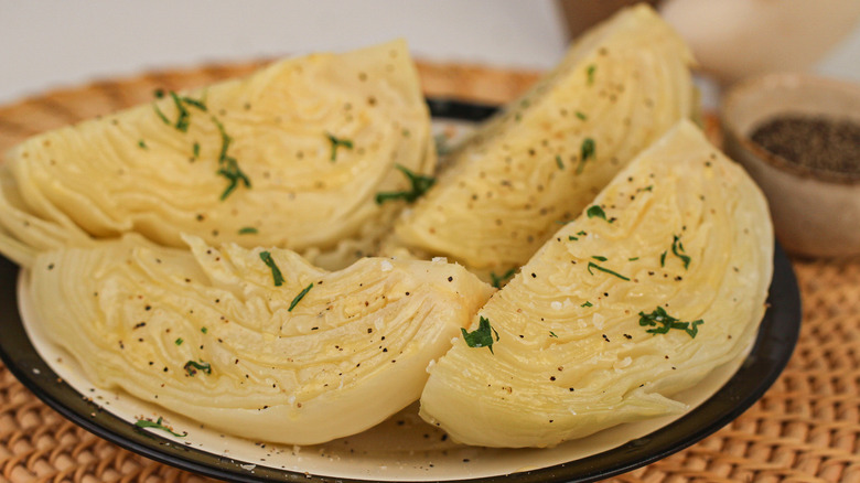 Wedges of boiled cabbage on serving dish