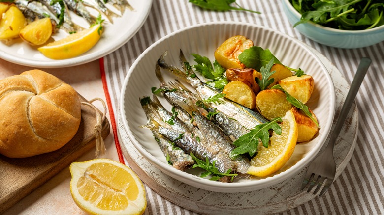 plate of sardines with herbs and lemon