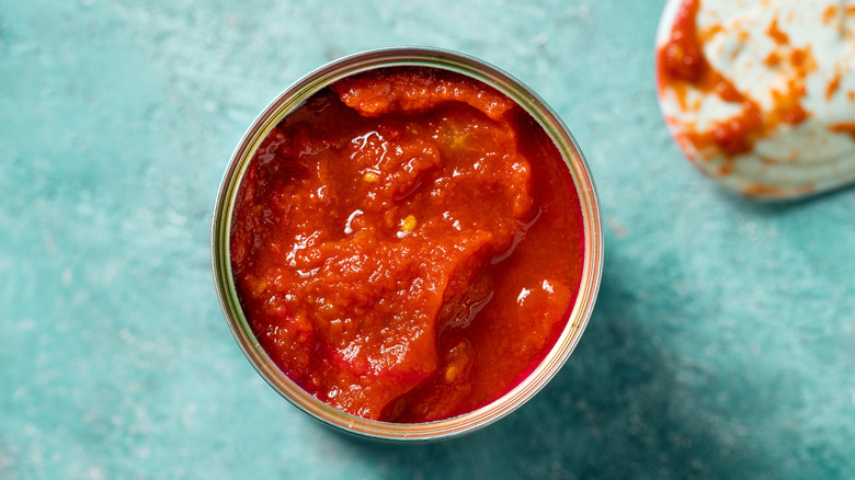 An opened can of tomato sauce.