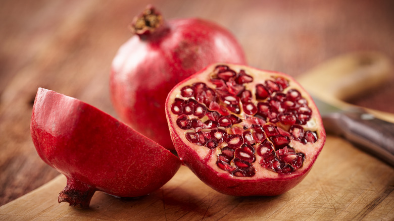 Sliced pomegranate filled with seeds