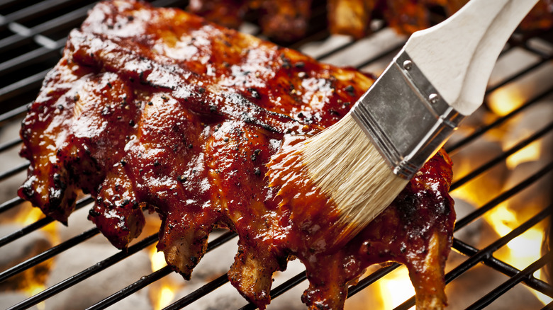 Glazing ribs on a grill