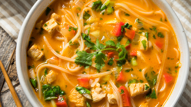 Bowl of colorful Thai chicken coconut curry