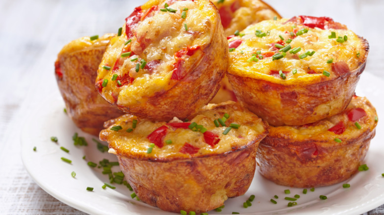 egg muffins on white plate with chives