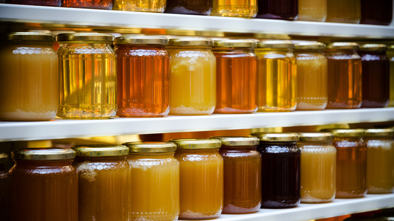 Jars of honey on shelf