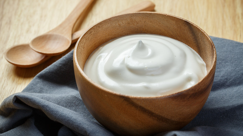 Yogurt in wooden bowl