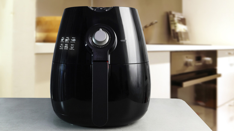 black air fryer on countertop