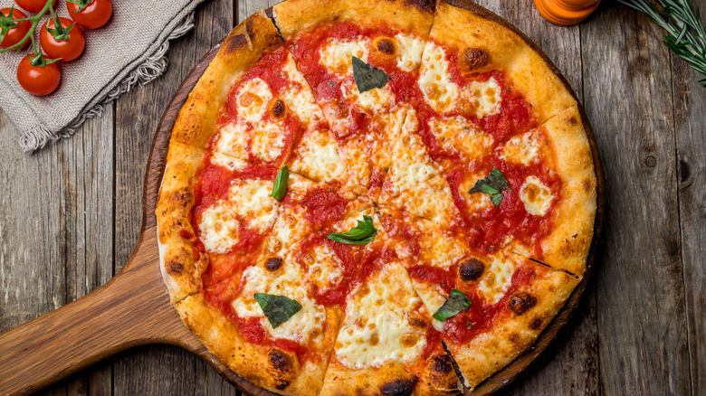 Margherita pizza on wooden board