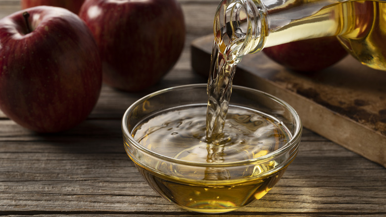 Apple cider vinegar poured into bowl