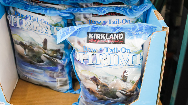 Bags of raw shrimp in Kirkland Signature packaging