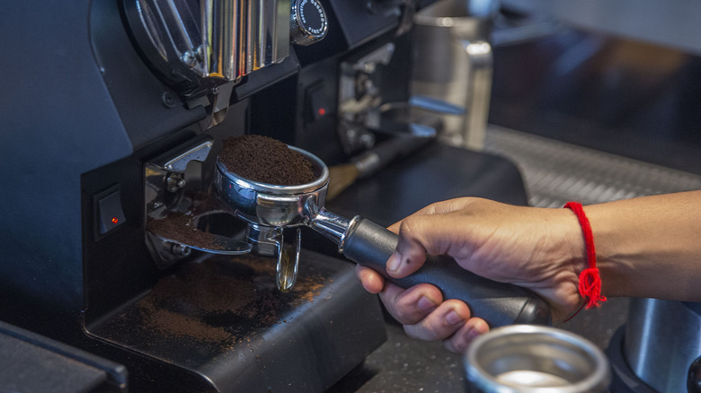 barista prepares espresso