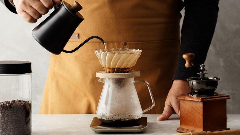 Person making filter coffee