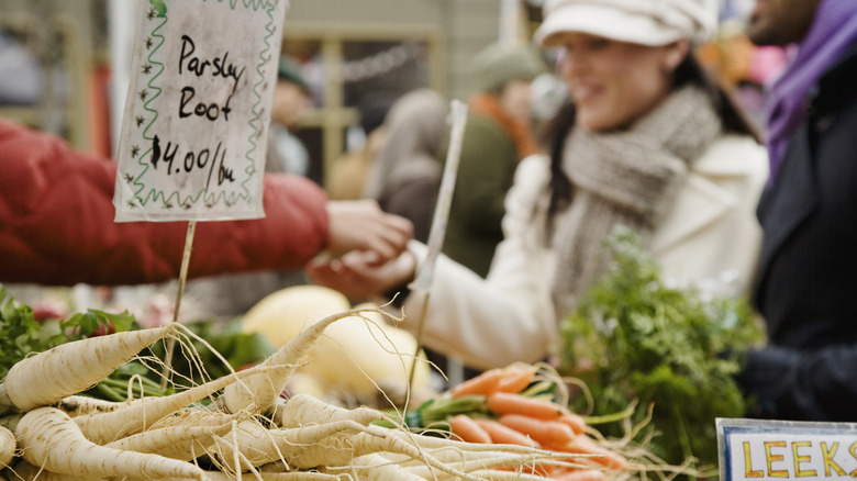 Buying produce at farmer's market 