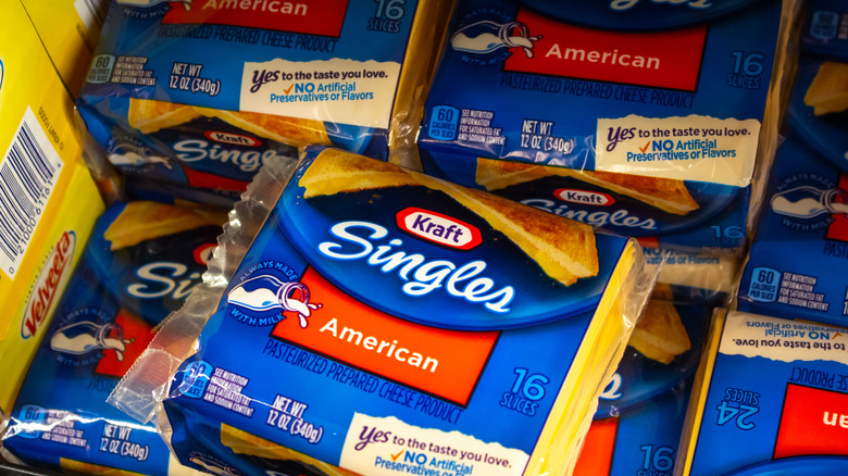 Packages of Kraft Singles American cheese in bin