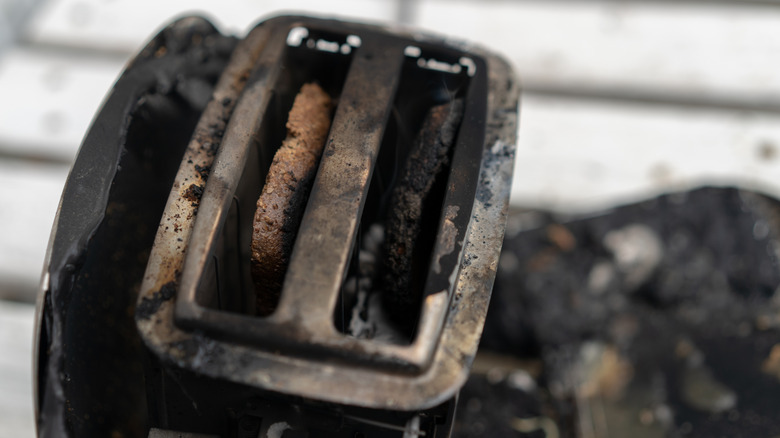 burned toaster that has caught on fire