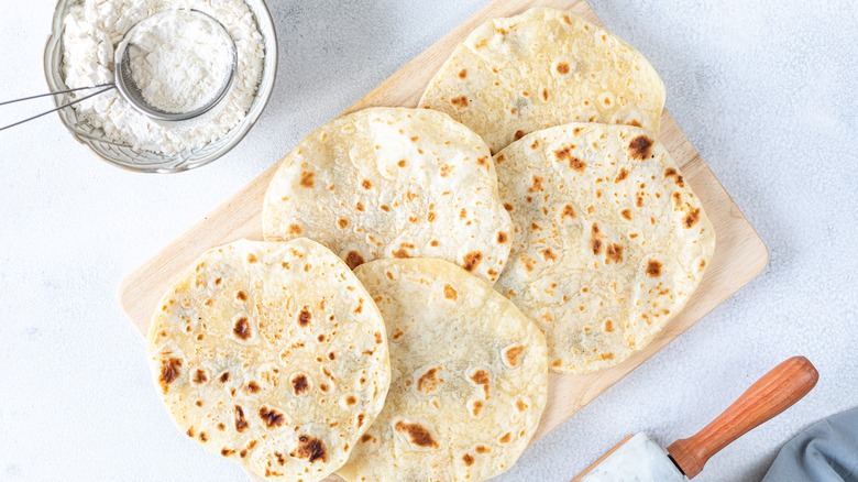 Flour tortillas on wooden board