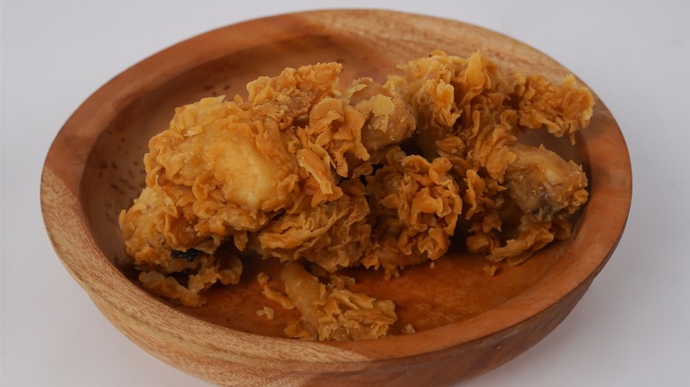 fried chicken in wooden bowl