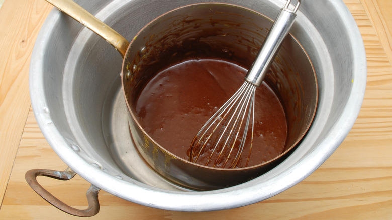 double boiler with whisked chocolate