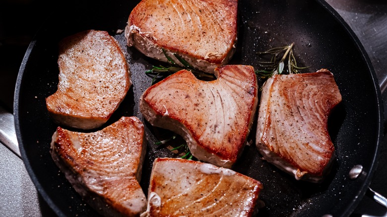 seared tuna steaks in a pan