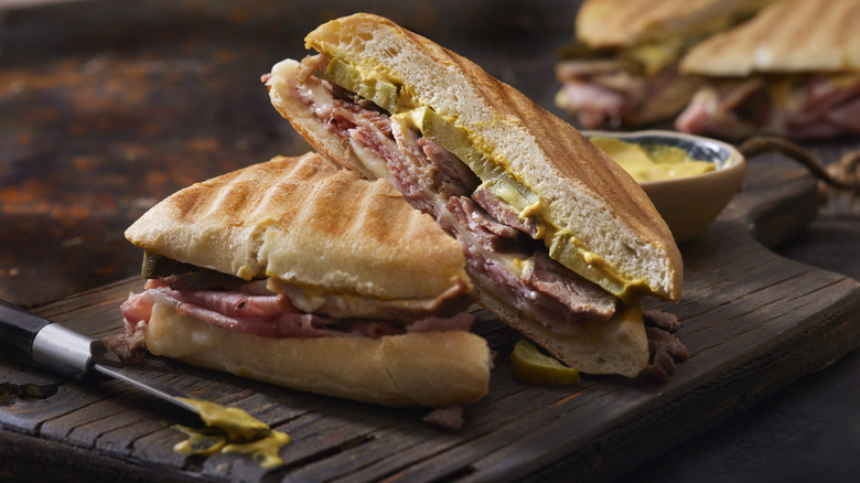 Cuban sandwich with knife, mustard