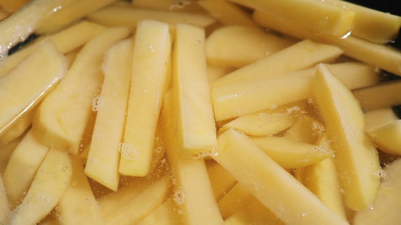 french fries soaking in water