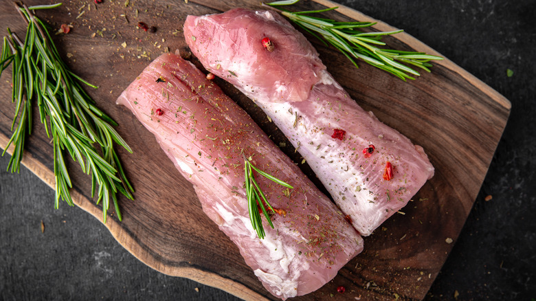 Raw, seasoned pork tenderloin 