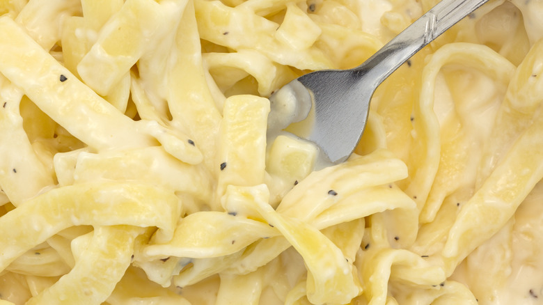 Microwaved pasta with fork