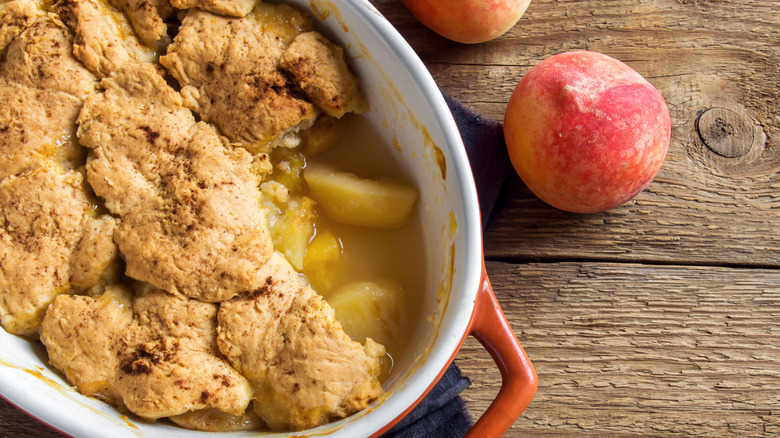 sliced peach cobbler in tray